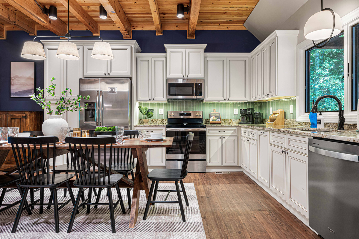 Fully equipped kitchen with granite countertops and a huge table to fit everyone for dinners!