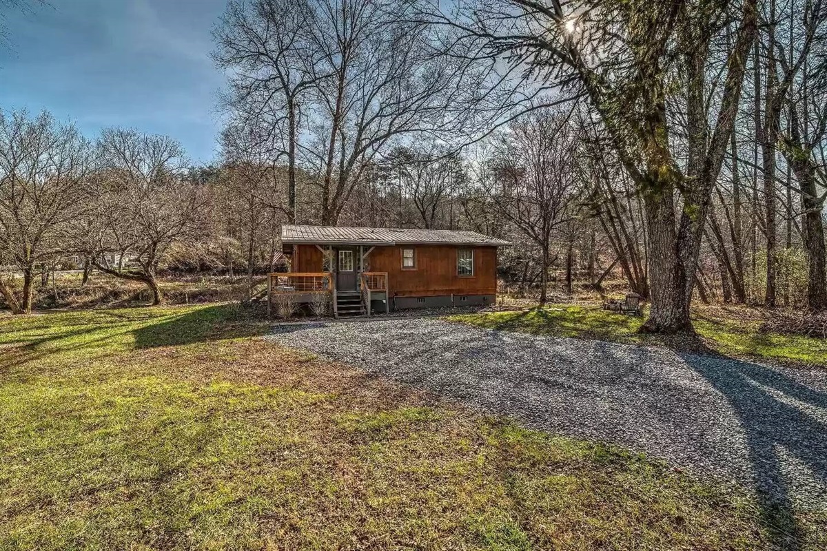 Front of house with gravel-paved parking