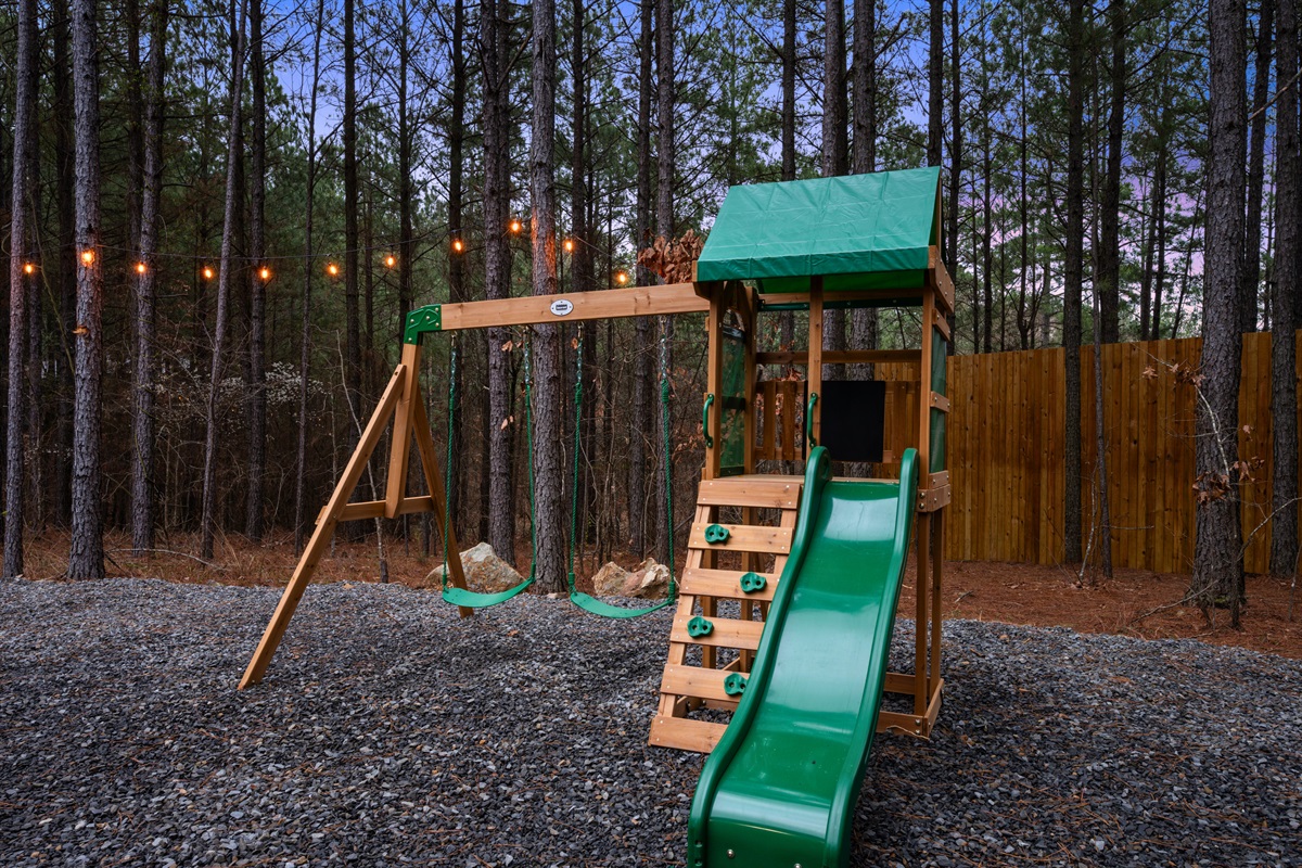 The swing set and slide offer another fun outdoor activity, giving kids plenty of room to play while adults relax nearby.