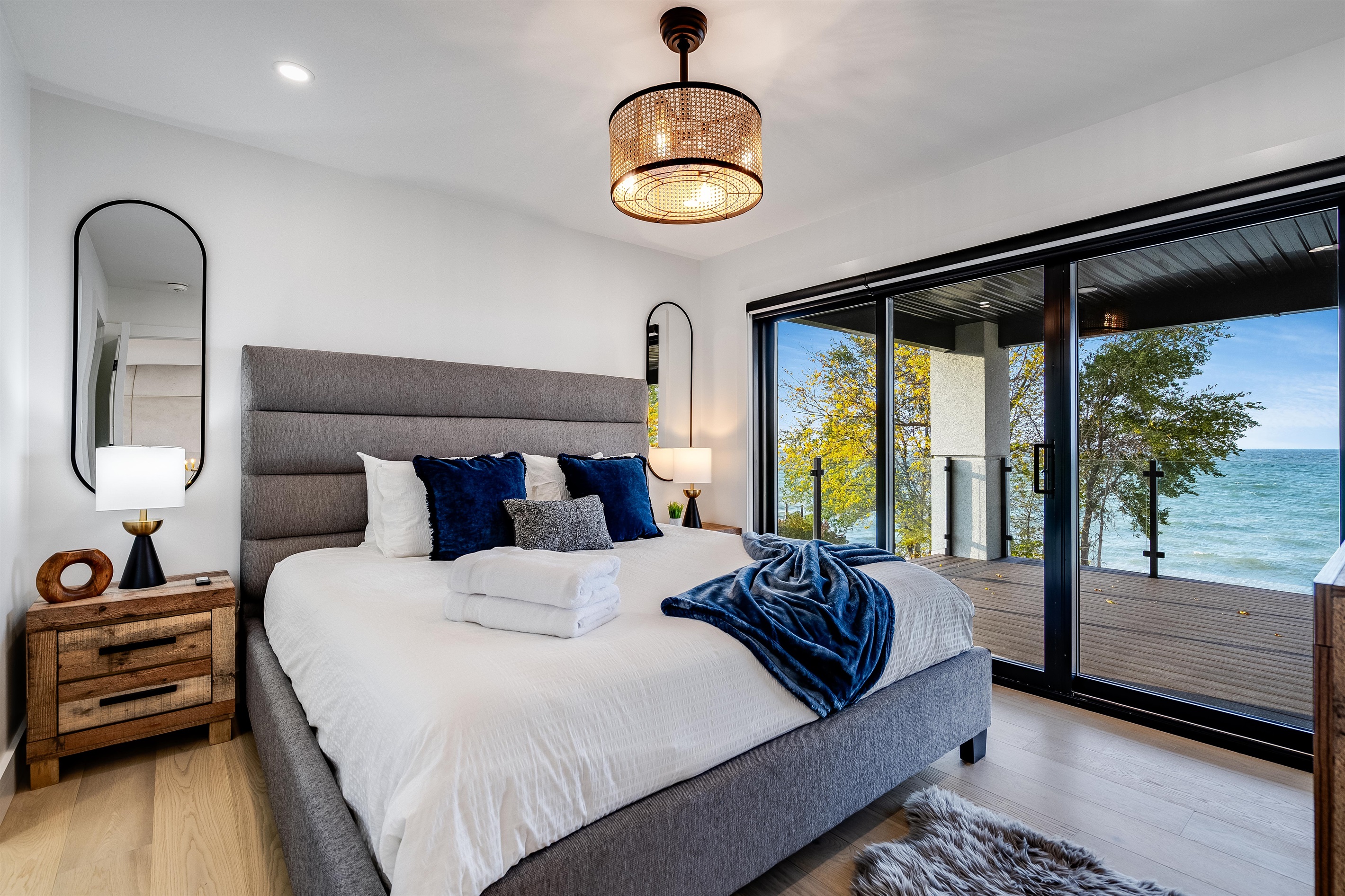 Balcony Queen Suite with lake view and ensuite bathroom.