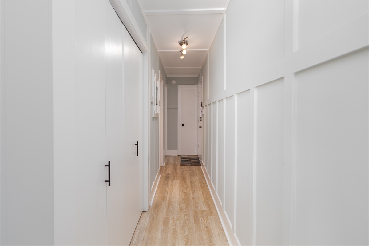 hallway looking at front door and bedroom