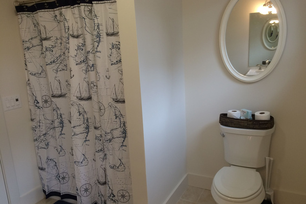 Bathroom off room with three twin beds.