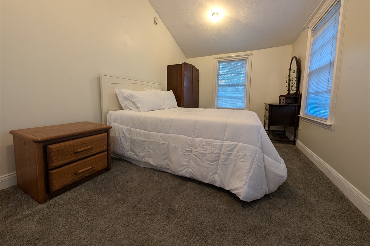Upstairs guest bedroom with queen bed