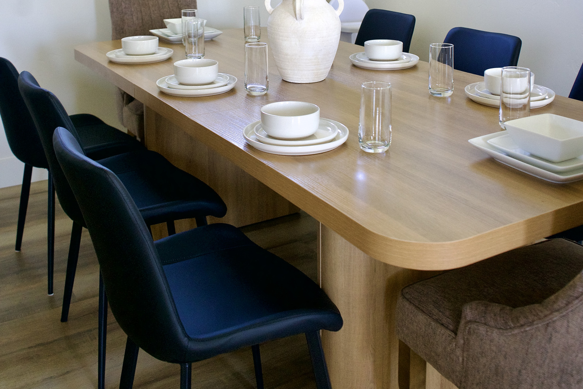 Large kitchen table designed for family gatherings, comfortably seating up to 8 guests.