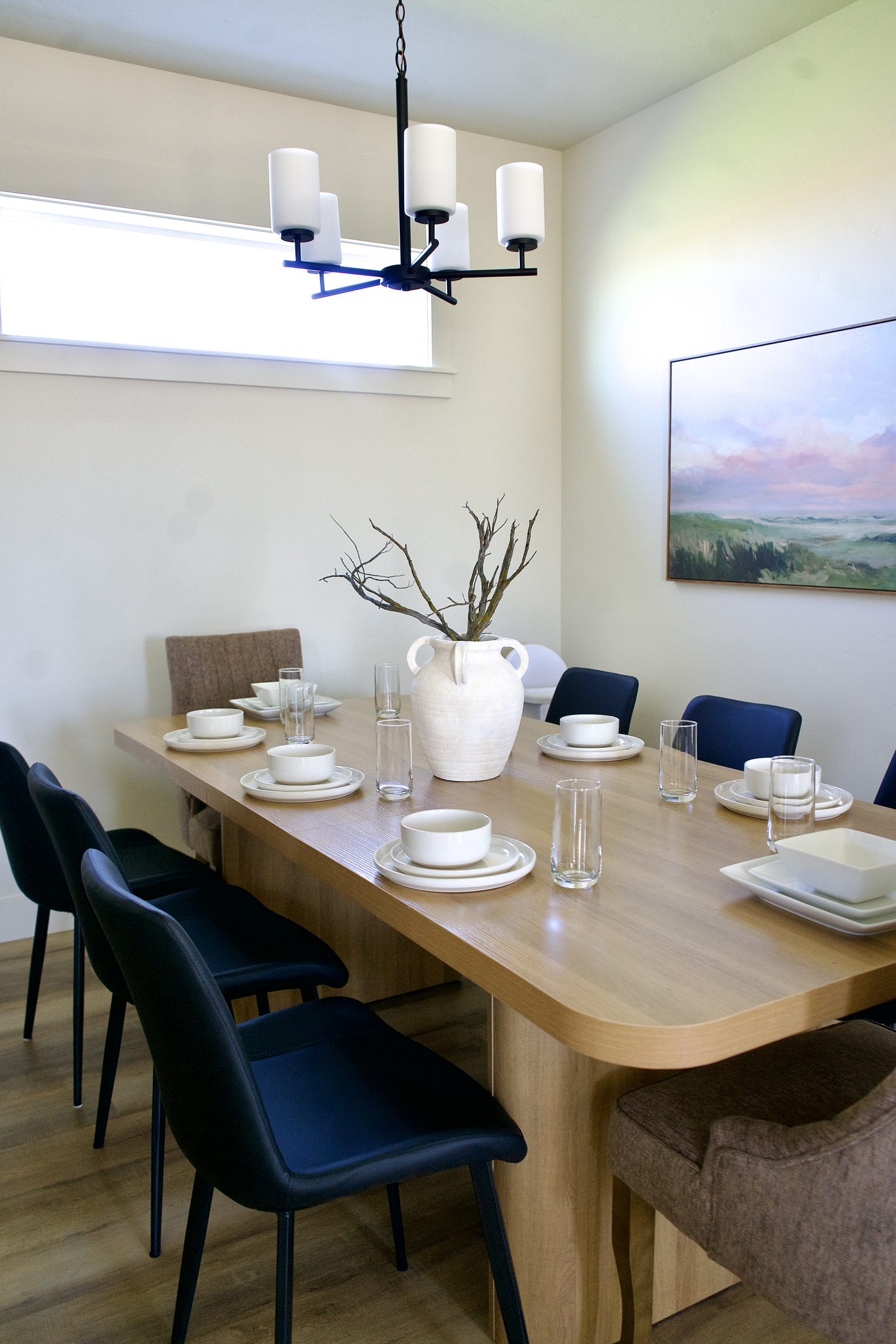 Large kitchen table designed for family gatherings, comfortably seating up to 8 guests.