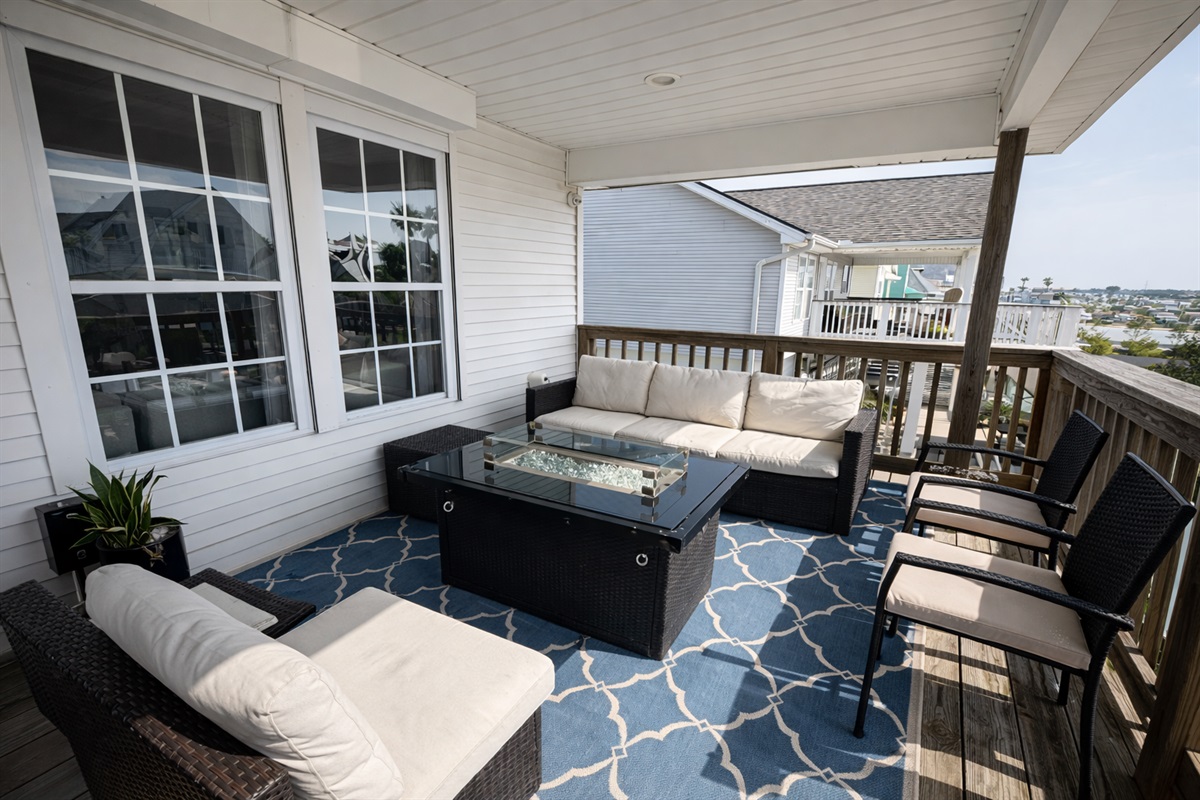 Upstairs lounging area with a fire table for those chilly nights