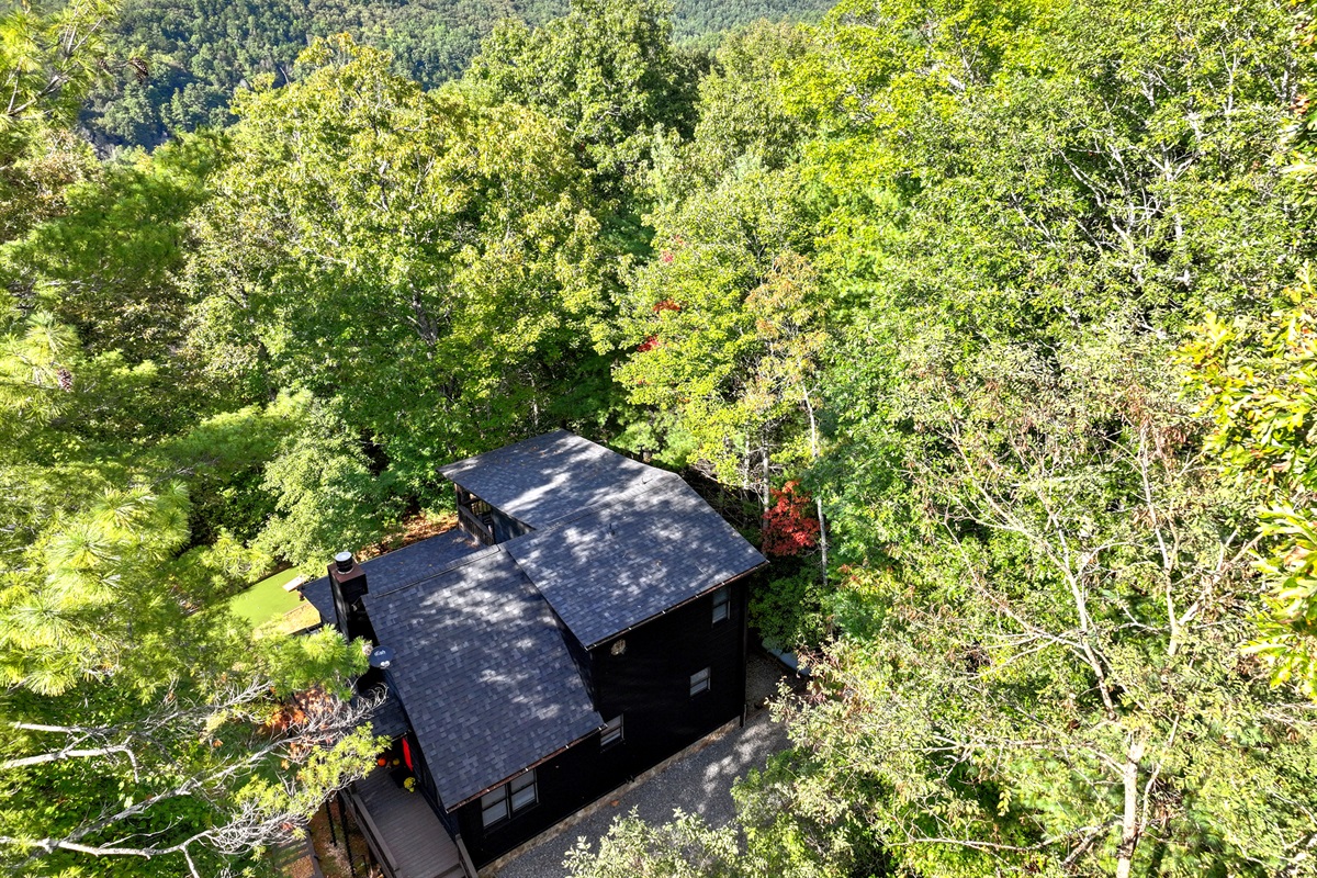 From above, Enchanted Hideaway reveals her charm... nestled among trees, private and serene.