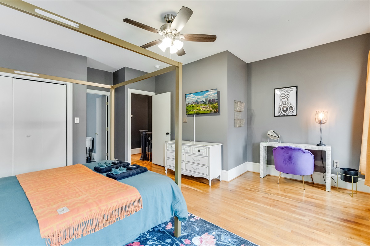 Queen Bedroom 2: Modern decor meets vibrant colors for a stylish stay in Richmond!