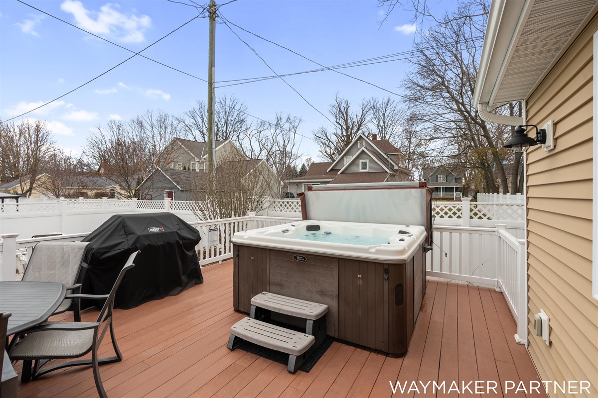 Walk out to our back patio and enjoy the relaxing hot tub. There is also a grill and plenty of seating for an outdoor meal.