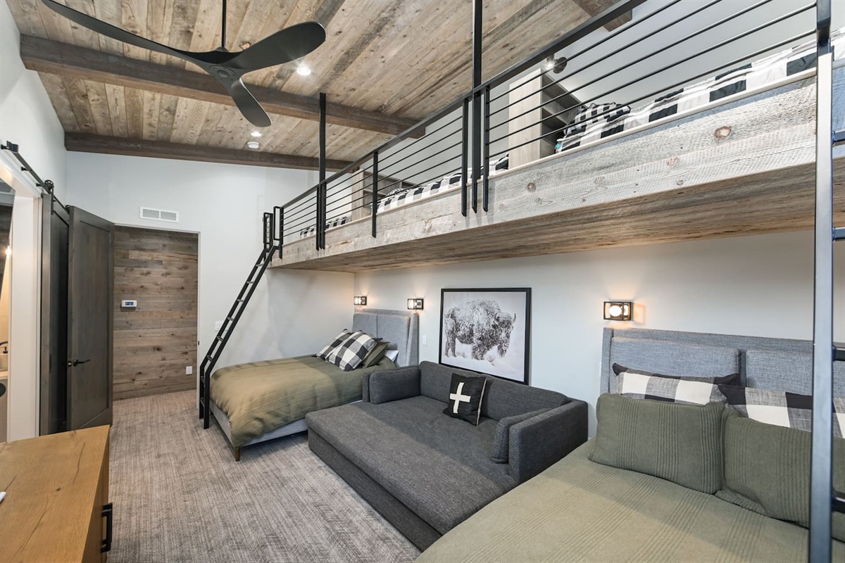 A spacious loft style room with cozy modern vibes