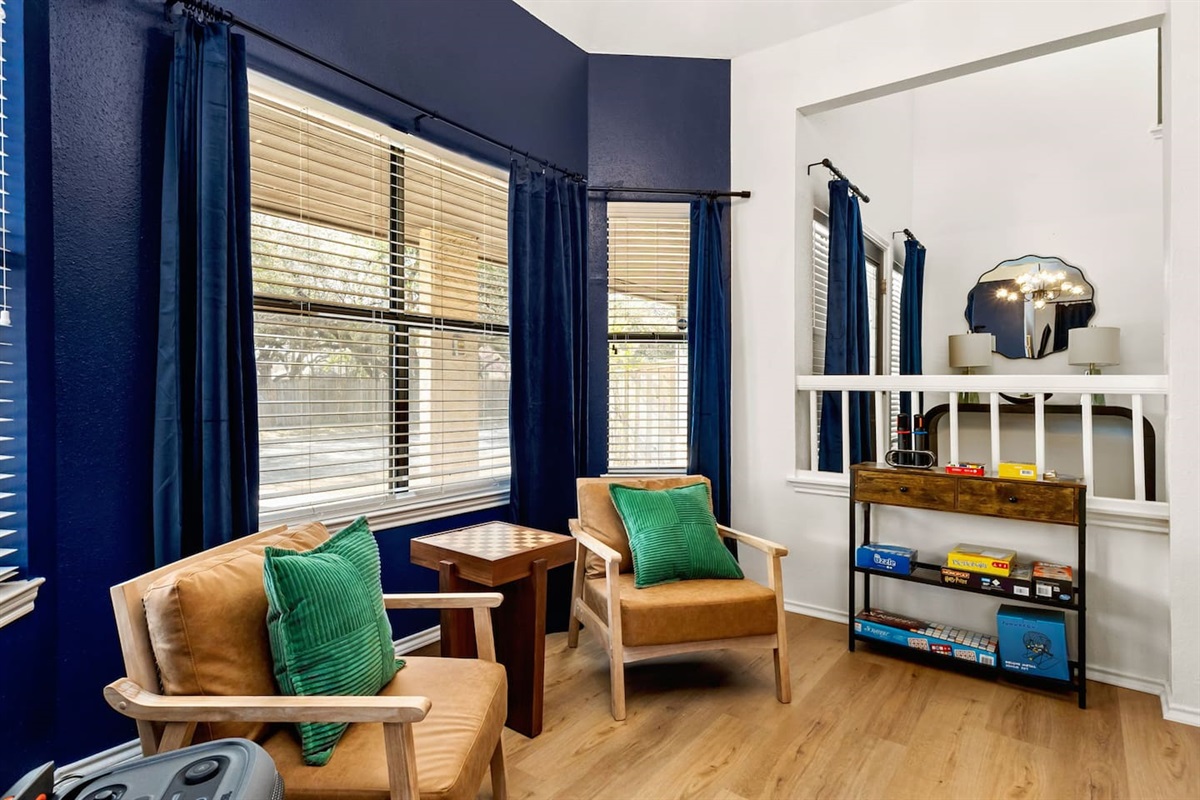 Unwind in this cozy game nook—perfect for morning coffee, quiet conversations, or a friendly round of chess. With board games stocked and comfy seating by the window, it's a favorite hangout spot for families and friends alike!