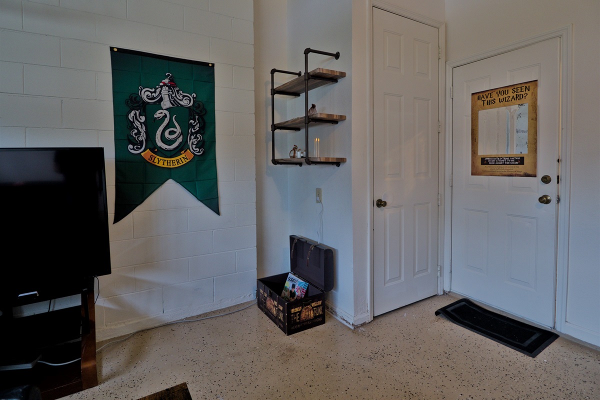 Harry Potter themed game room with TV, pool table/table tennis.