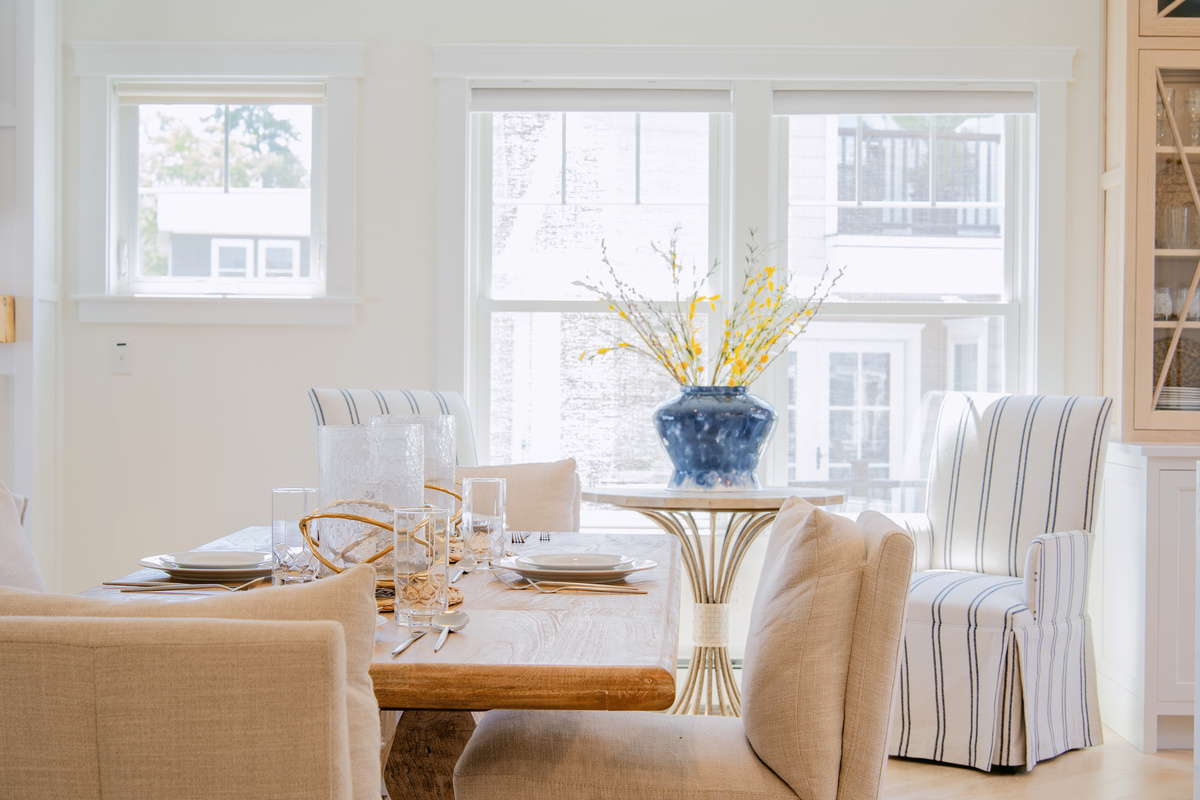 Gather around the dining table for relaxed meals in a bright, welcoming space filled with natural light.