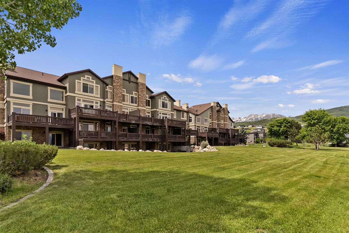 Beautifully maintained grounds surround the townhome, offering lush green space and a peaceful setting just steps from the lake.