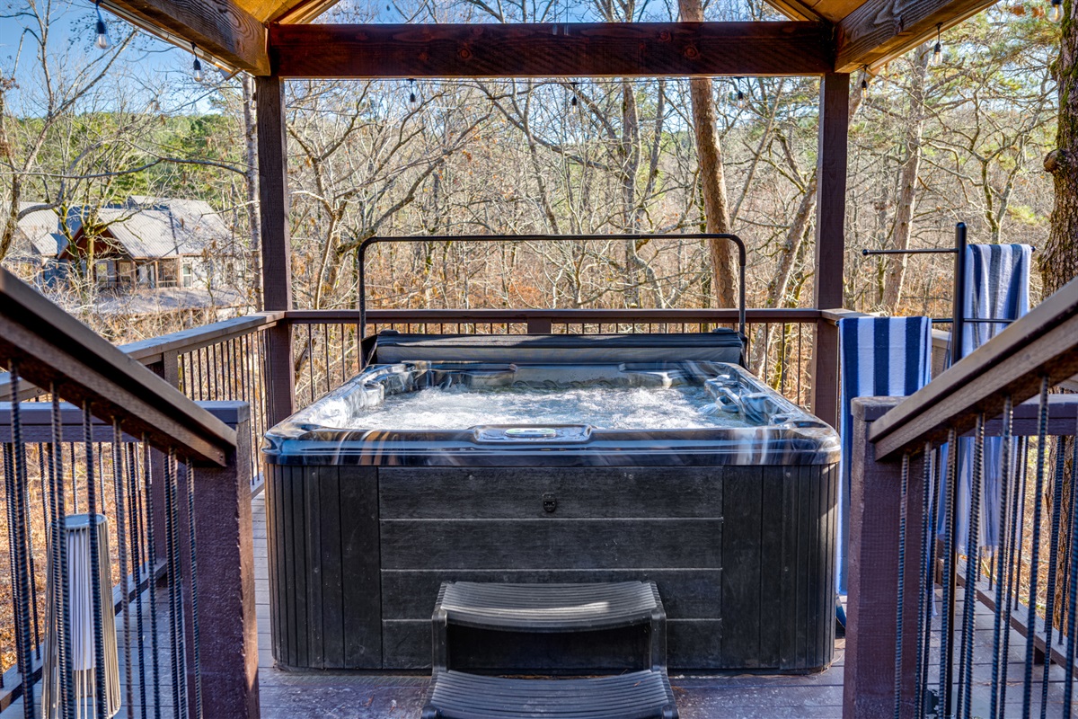 Hot Tub Oasis: Soak in serenity while surrounded by nature’s beauty and calming sounds!