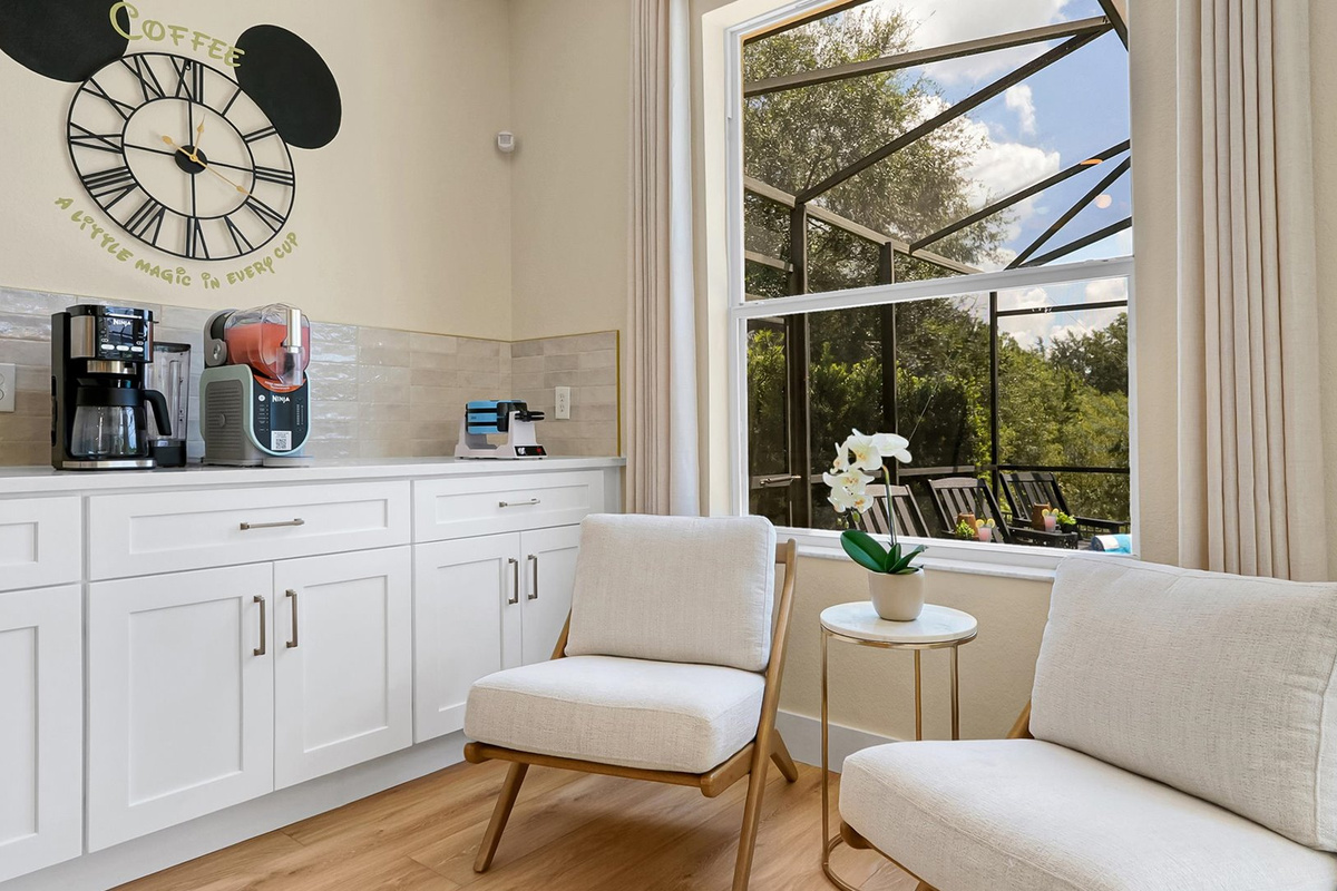 Coffee Bar and Sitting Area: Dedicated coffee bar with comfortable seating and peaceful views toward the private pool and conservation.