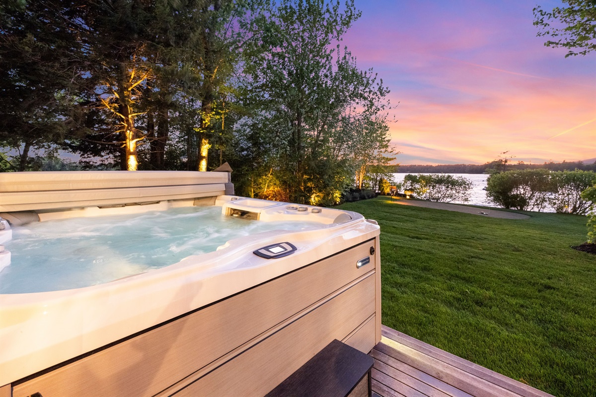 Hot tub deck off master bedroom overlooking Lake Winnipesuakee with mountain and sunset views