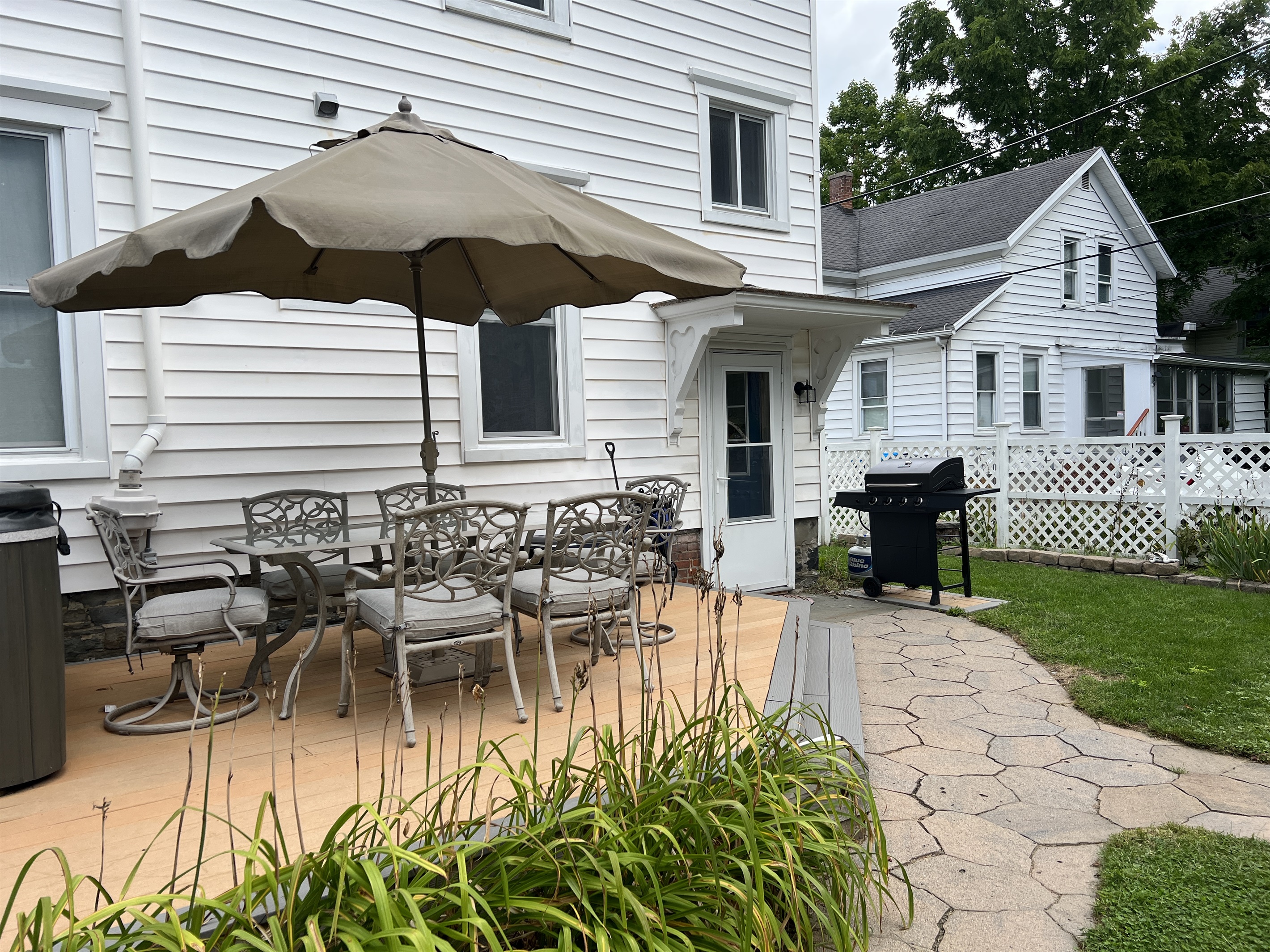 Back porch with hot tub, picnic table, bbq
