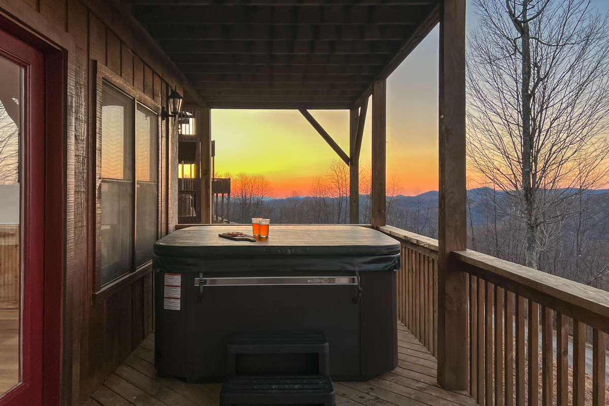 Soak in the covered outdoor hot tub while watching the sun set over the mountains.