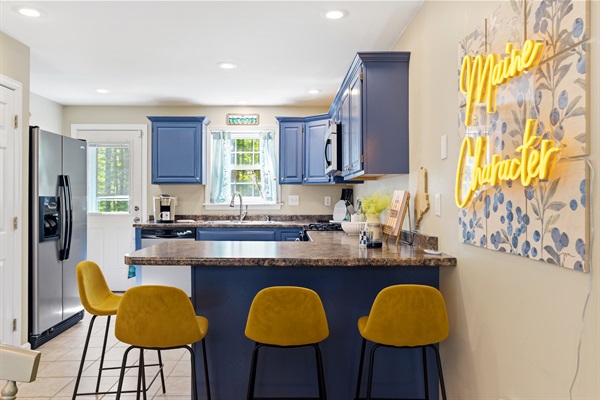 A stylish kitchen island with seating, perfect for casual dining, morning coffee, and gathering while meals are being prepared.