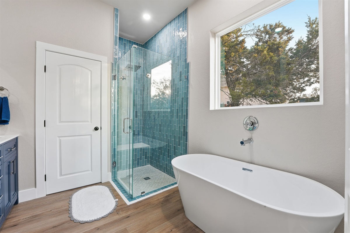 Large ensuite bathroom with dual vanity and generous walk-in shower.
