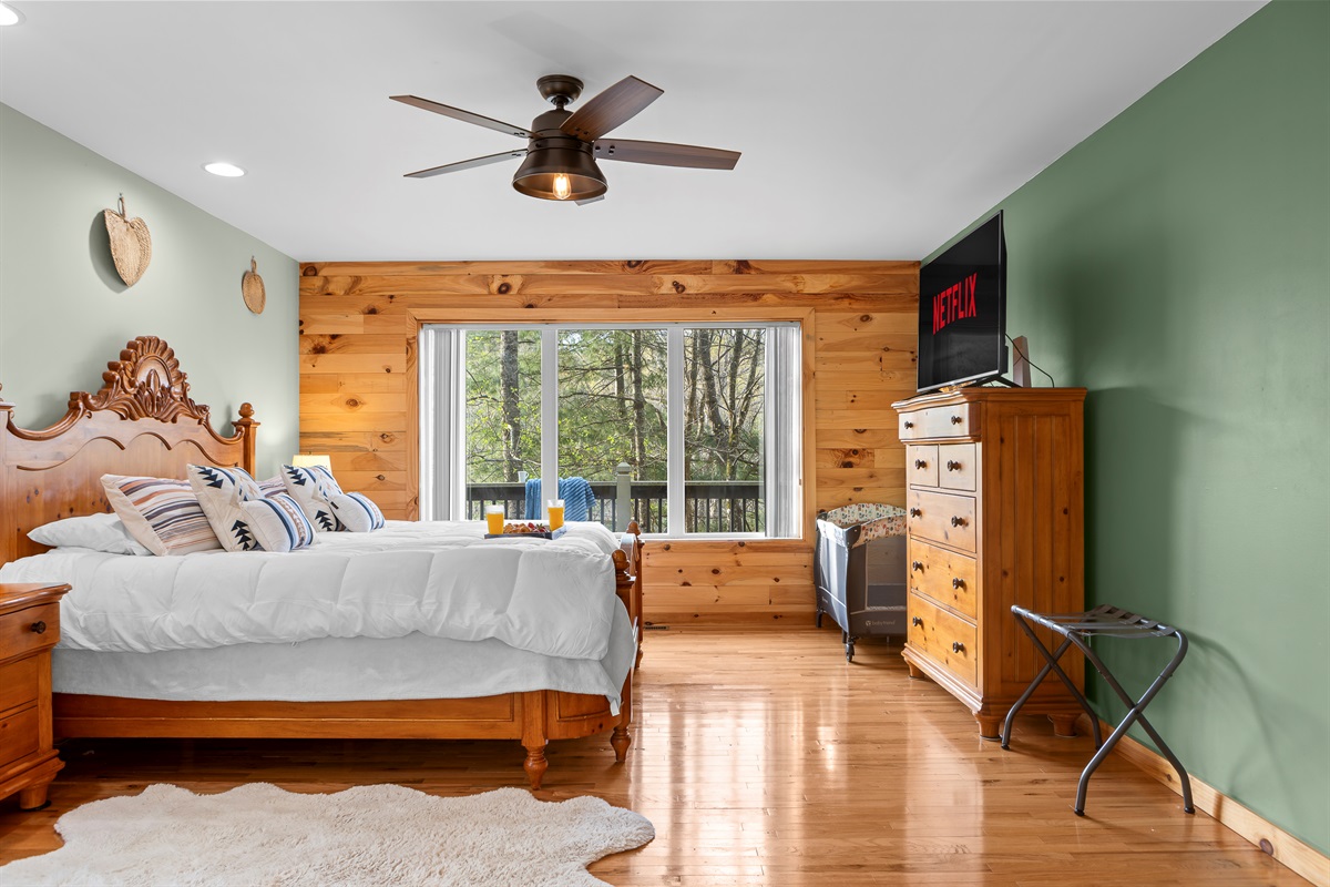Master King Bedroom 1: Wake up to nature views and enjoy a serene retreat with stylish decor!