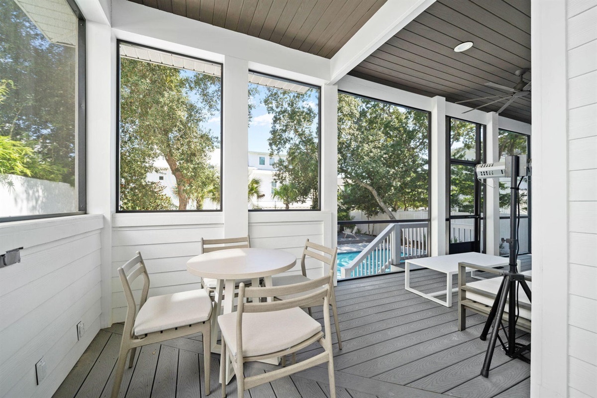 Dining area on screened rear porch.