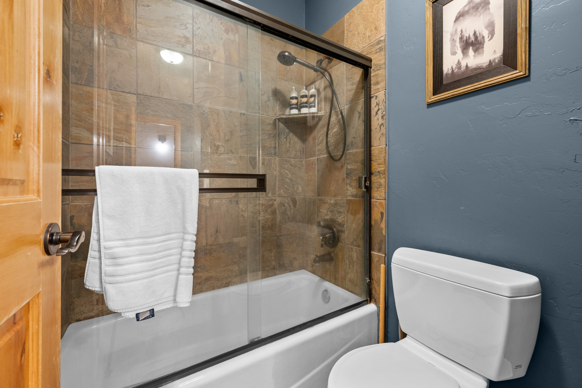 Tub and shower combination makes this bathroom convenient for both adults and families traveling with children.