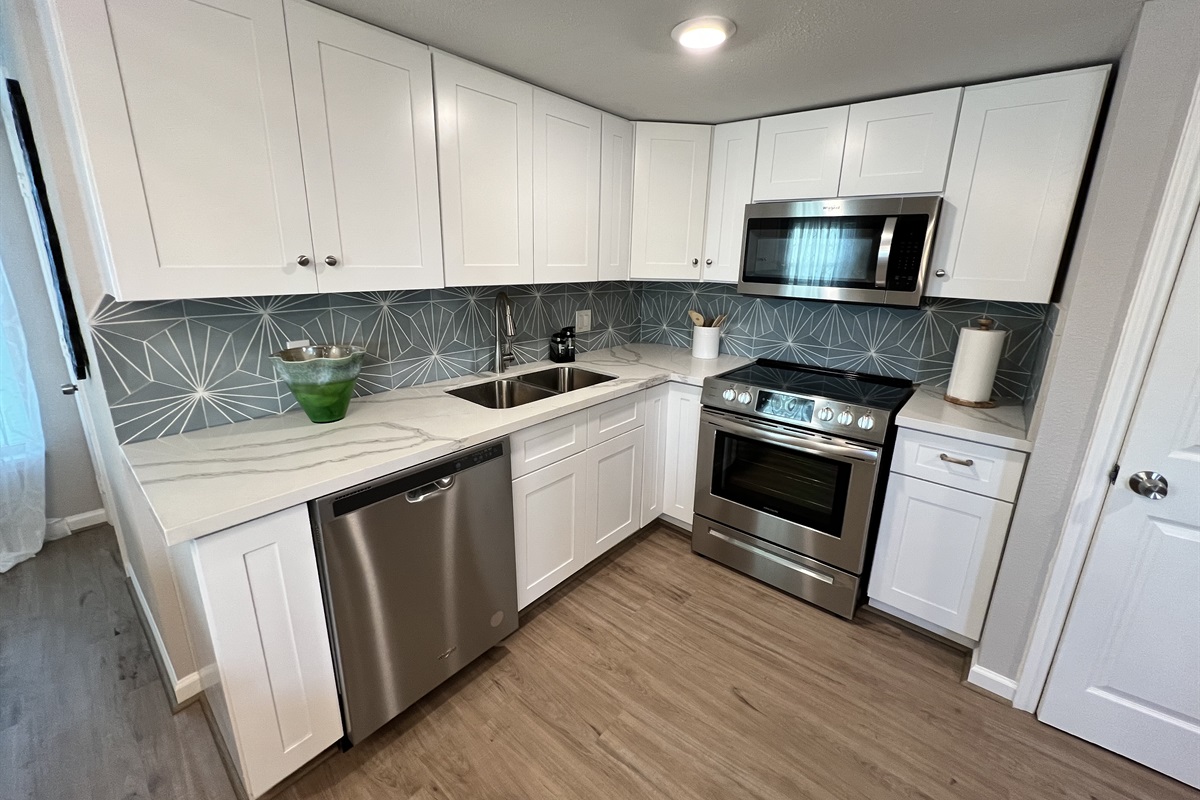 Kitchen- Has an electric stove, microwave and dishwasher