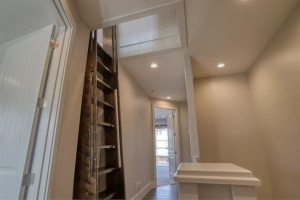 Loft Ladder and hallway to Master Suites