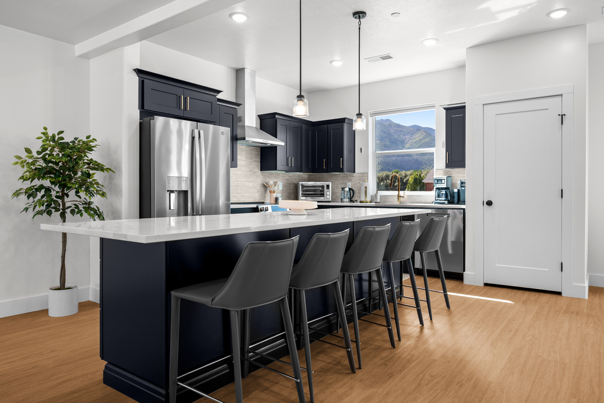 Pull up a seat at the oversized kitchen island for casual meals, morning coffee, or keeping the cook company.