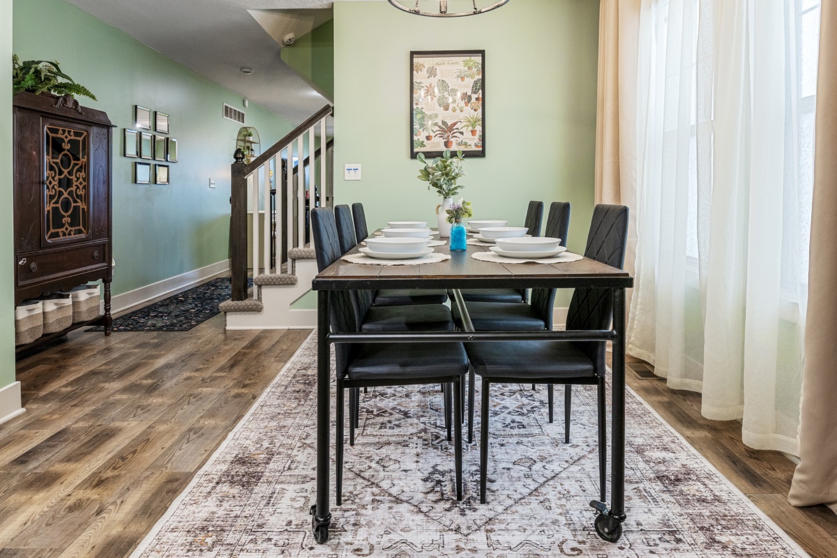 Casual dining area creates a welcoming place to share meals and connect with family or friends. Large windows help fill the space with natural light.