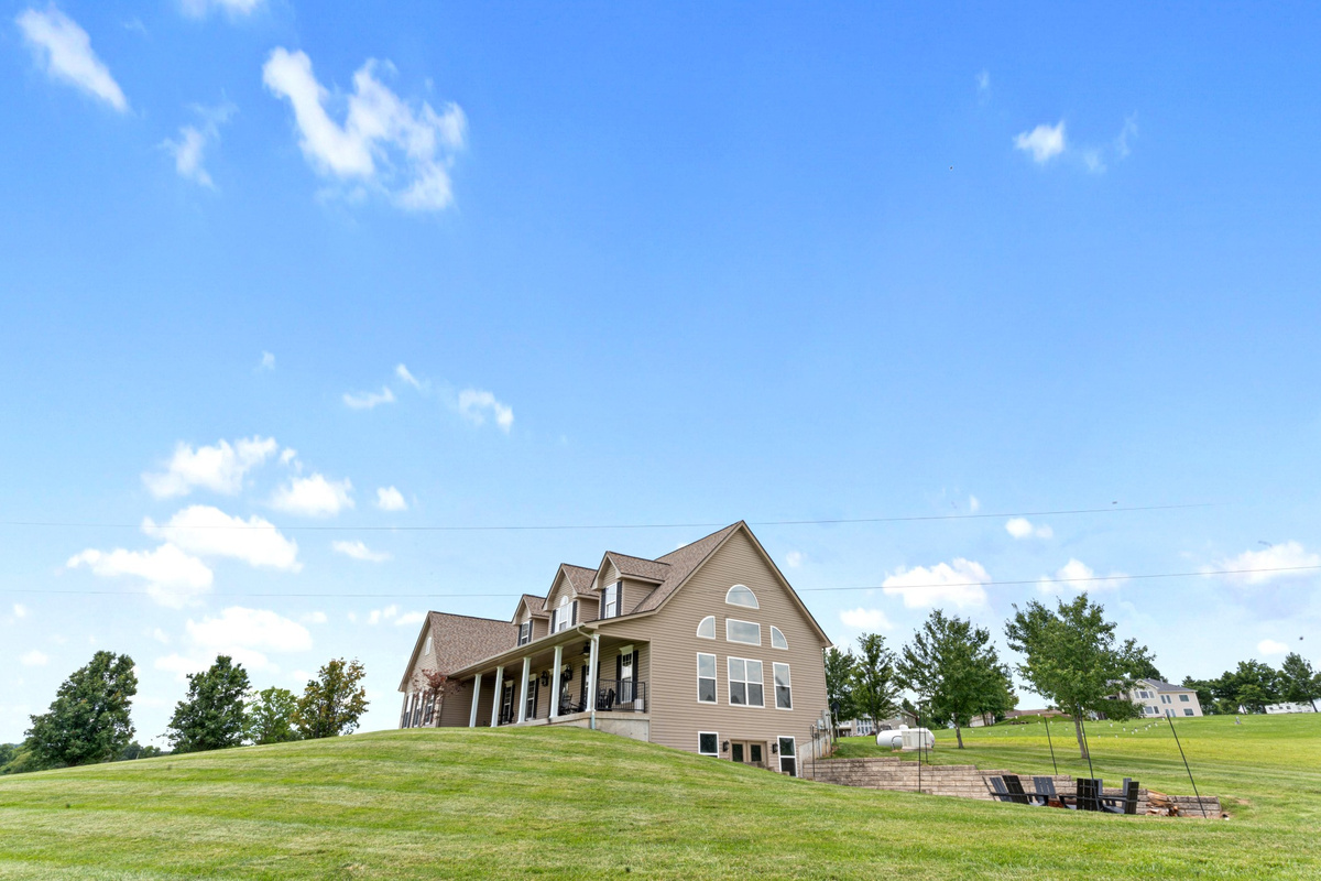 Spacious yard with peaceful valley views and plenty of room to relax or play.