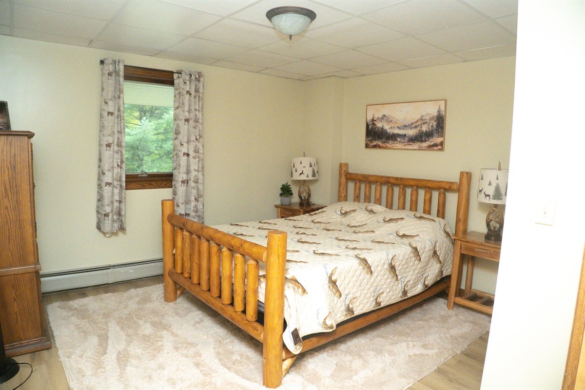 Queen bedroom in basement