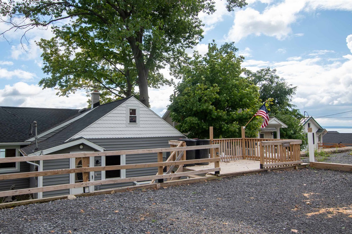 Elevated outdoor space with lake views and room to gather and relax