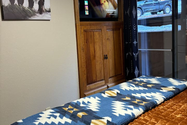 Primary Bedroom - Brand new 43 inch Smart TV and built in cabinet for clothing storage
