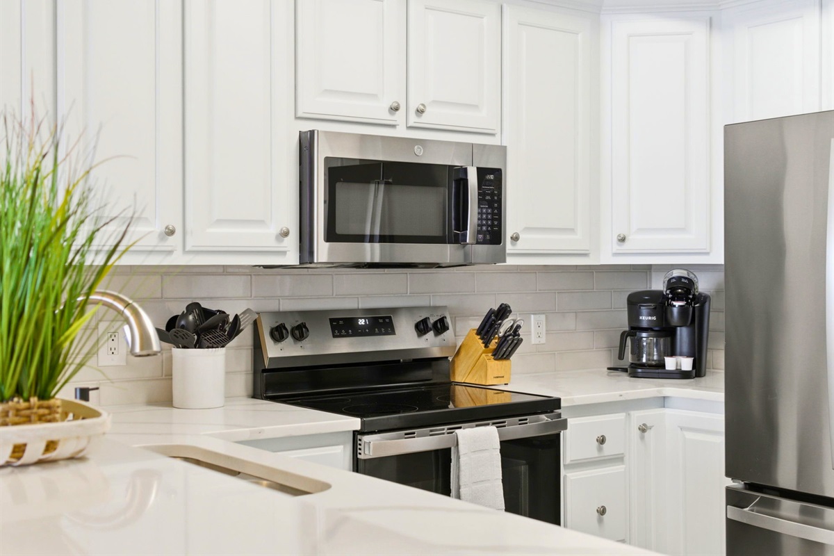Equipped with everything needed for home-cooked meals, the kitchen makes dining in both convenient and enjoyable.