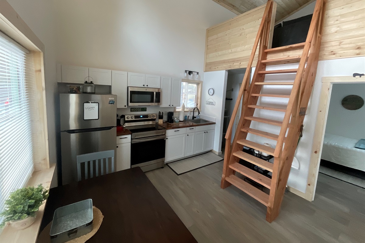 Main floor area.  Bedroom is to the right front.  Bathroom and laundry are to the right rear.  Ships ladder access to the loft living area and additional sleeping space.