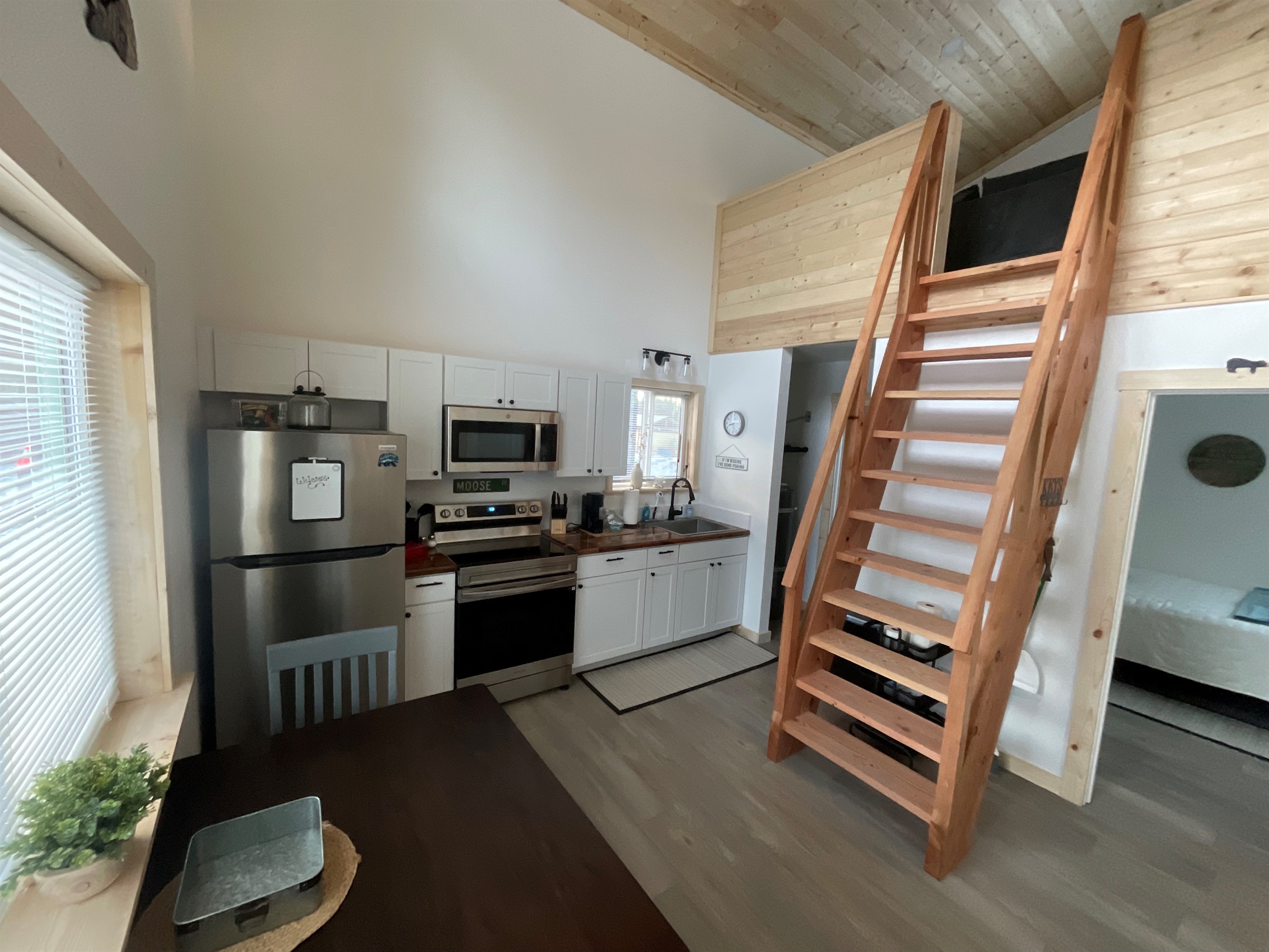 Main floor area.  Bedroom is to the right front.  Bathroom and laundry are to the right rear.  Ships ladder access to the loft living area and additional sleeping space.