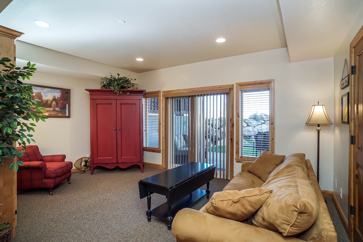 Lower-level living room with Murphy bed—perfect for additional guests.