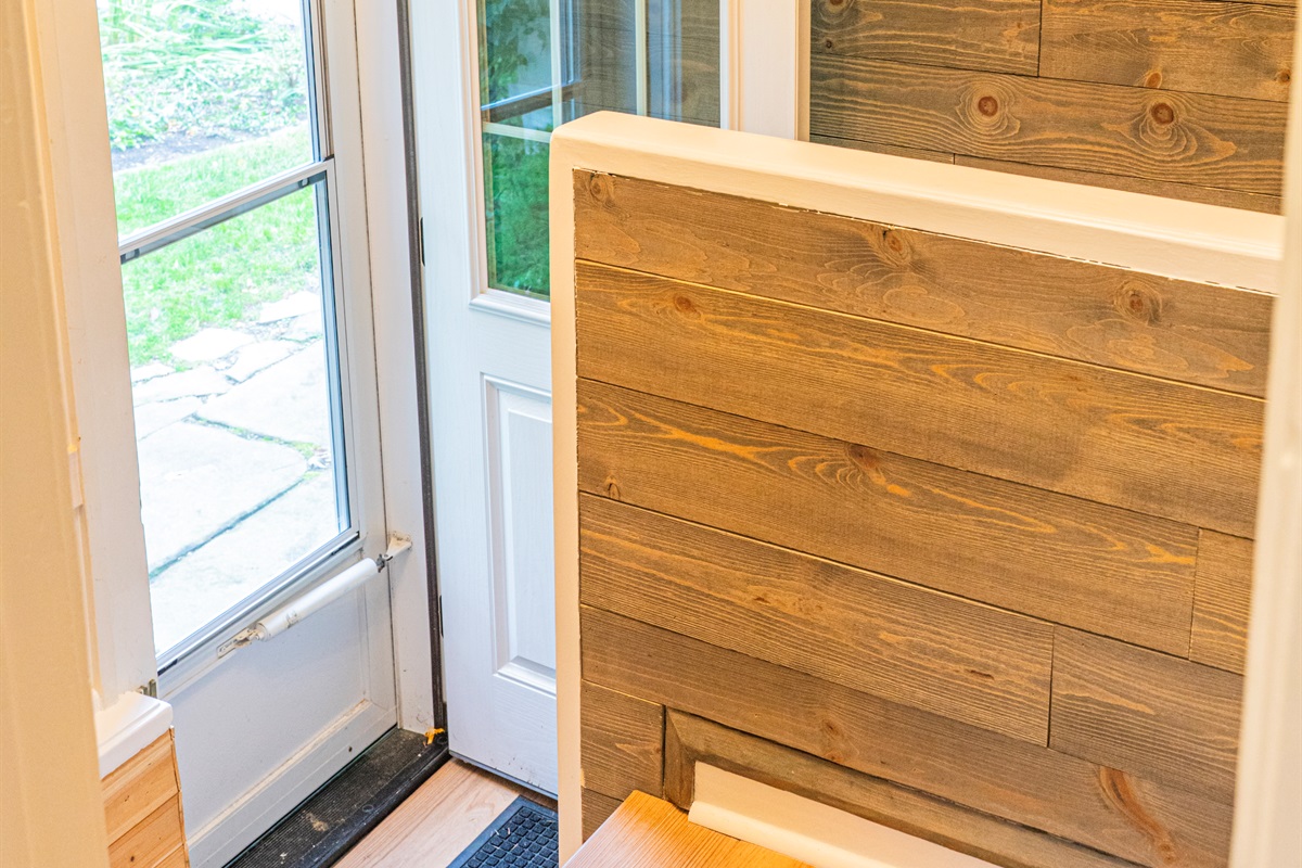 Back Entry Way with Stairs to the Kitchen & Stairs to the Basement