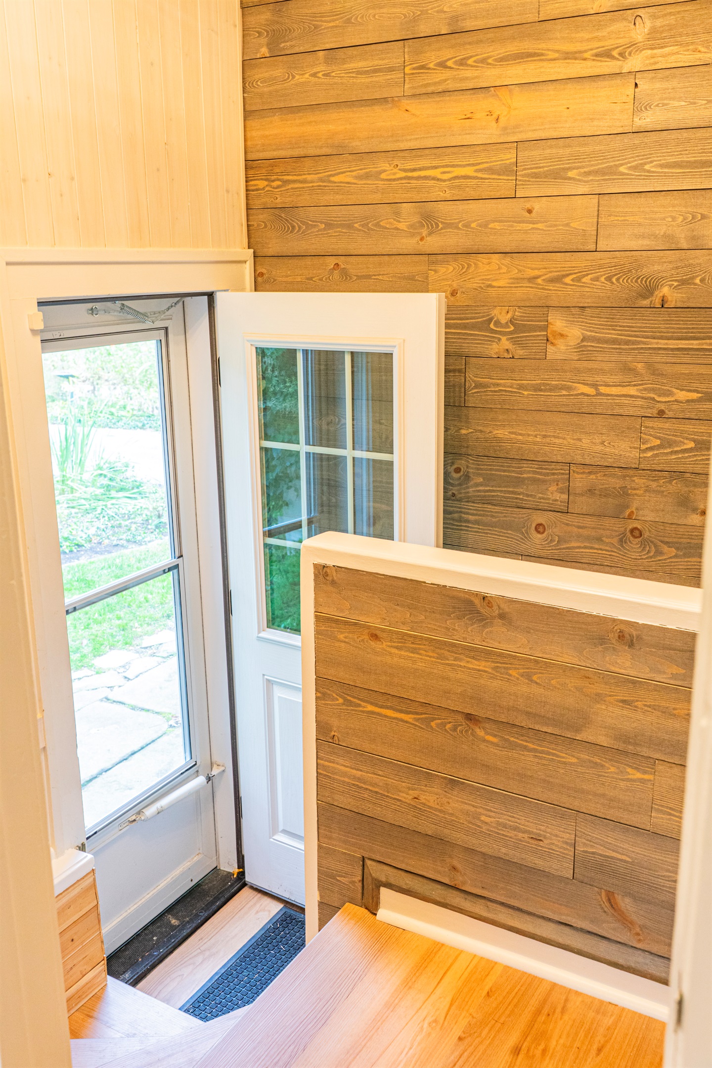 Back Entry Way with Stairs to the Kitchen & Stairs to the Basement
