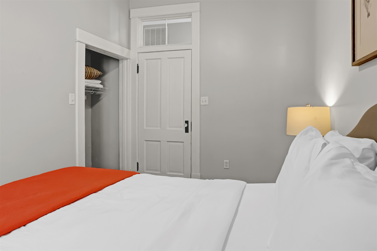 Soft linens and bright windows create a peaceful retreat.