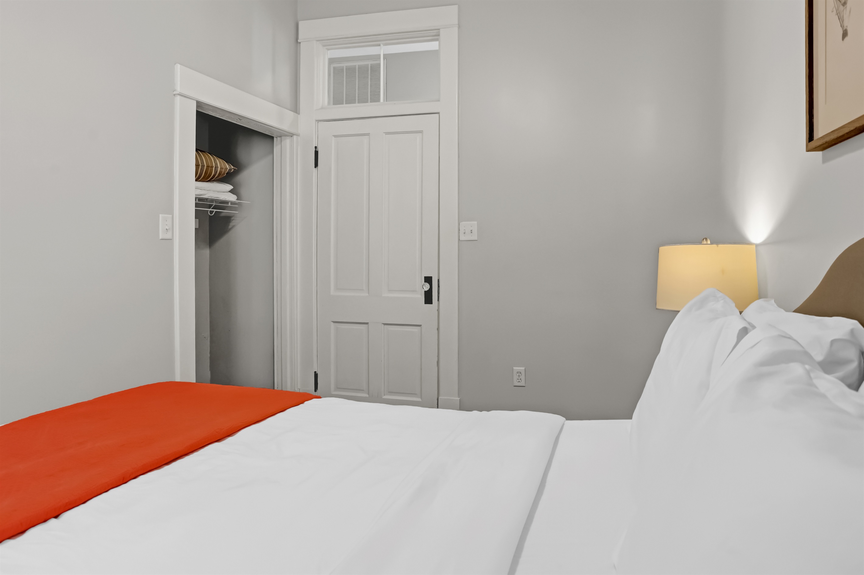Soft linens and bright windows create a peaceful retreat.