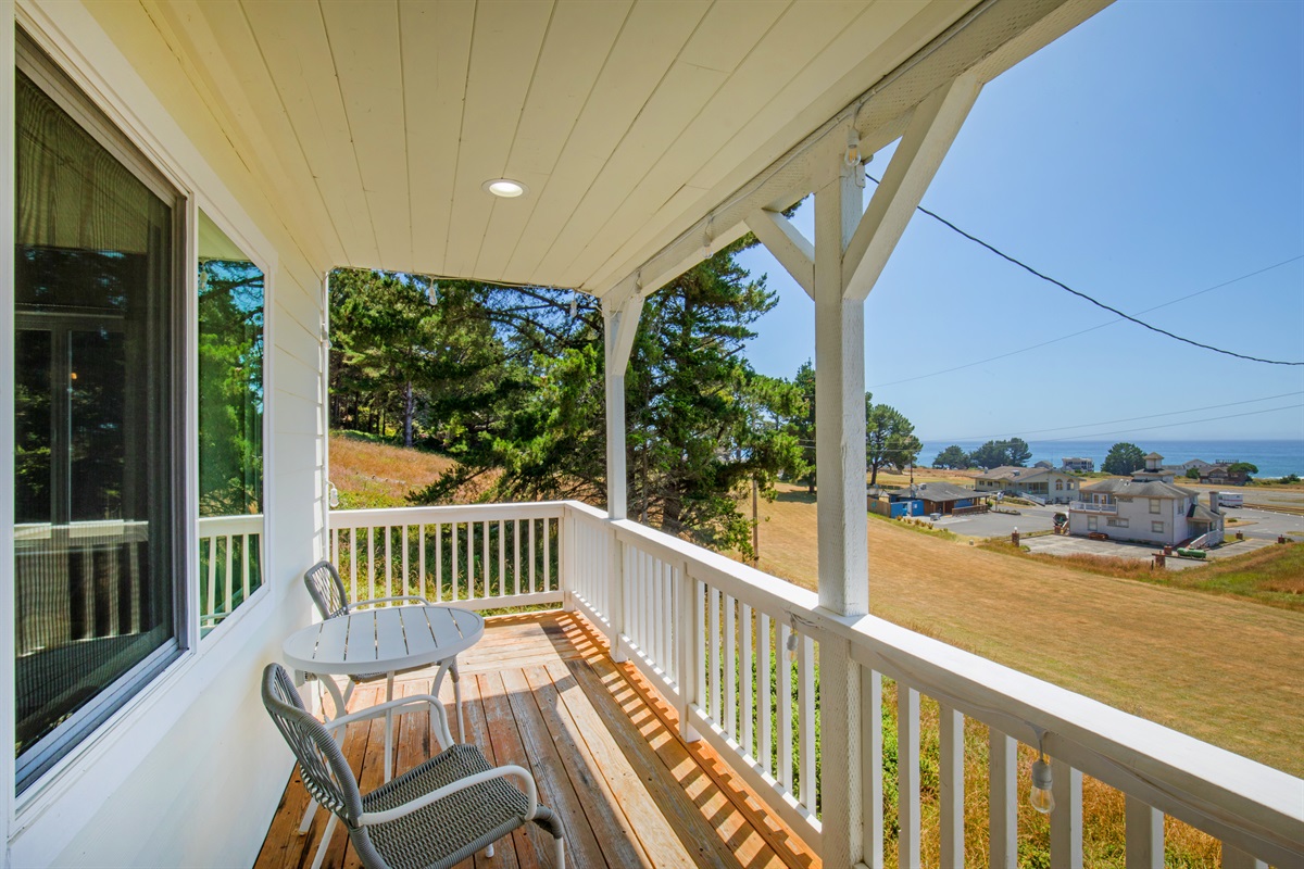 Enjoy morning coffee on the cozy deck facing the ocean