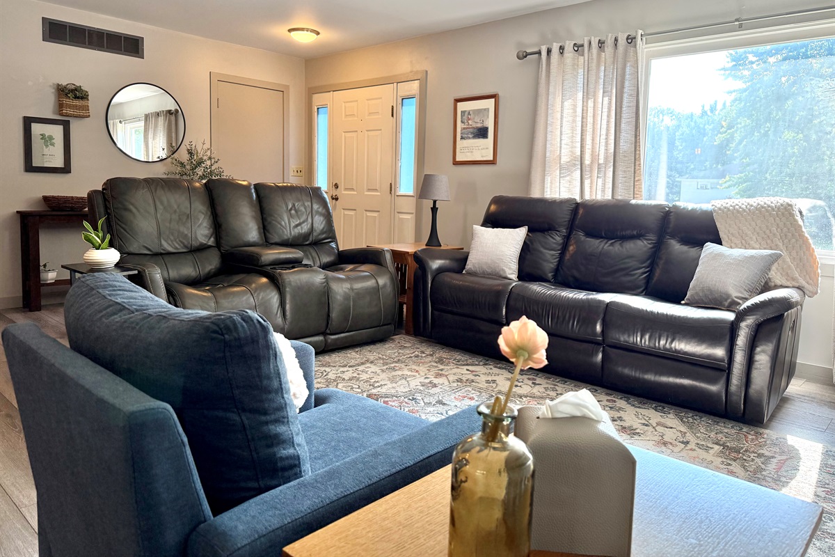 Get cozy! The main living room offers a couch, loveseat, chair, and smart TV. The perfect place to unwind after a fun filled day exploring Southwest MI. 
