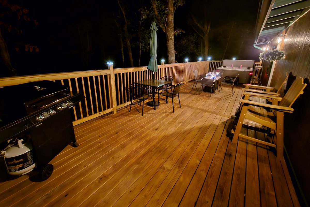 Light up the grill, pour a glass of wine, and enjoy the fire table glow — the deck comes alive at night.