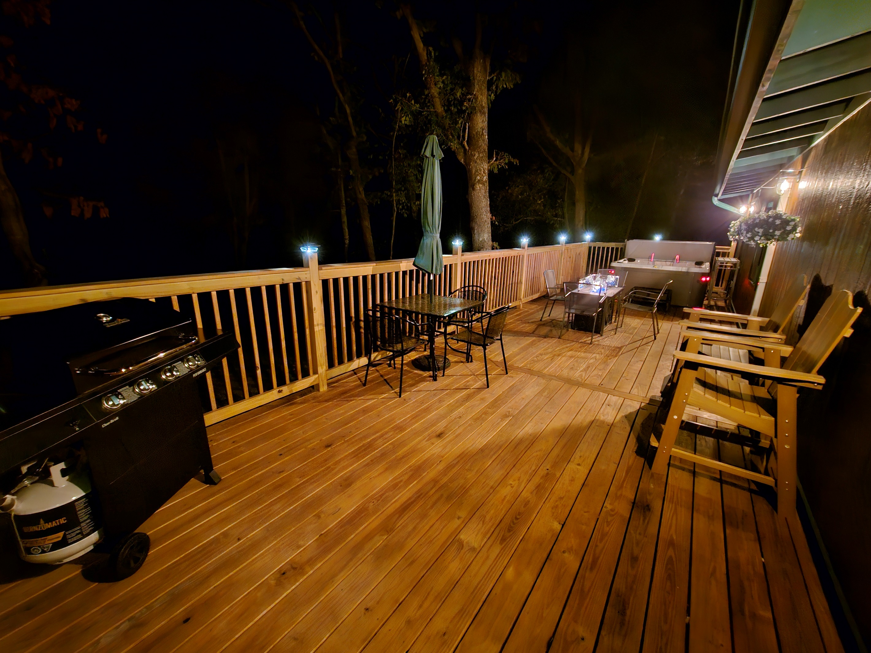 Light up the grill, pour a glass of wine, and enjoy the fire table glow — the deck comes alive at night.