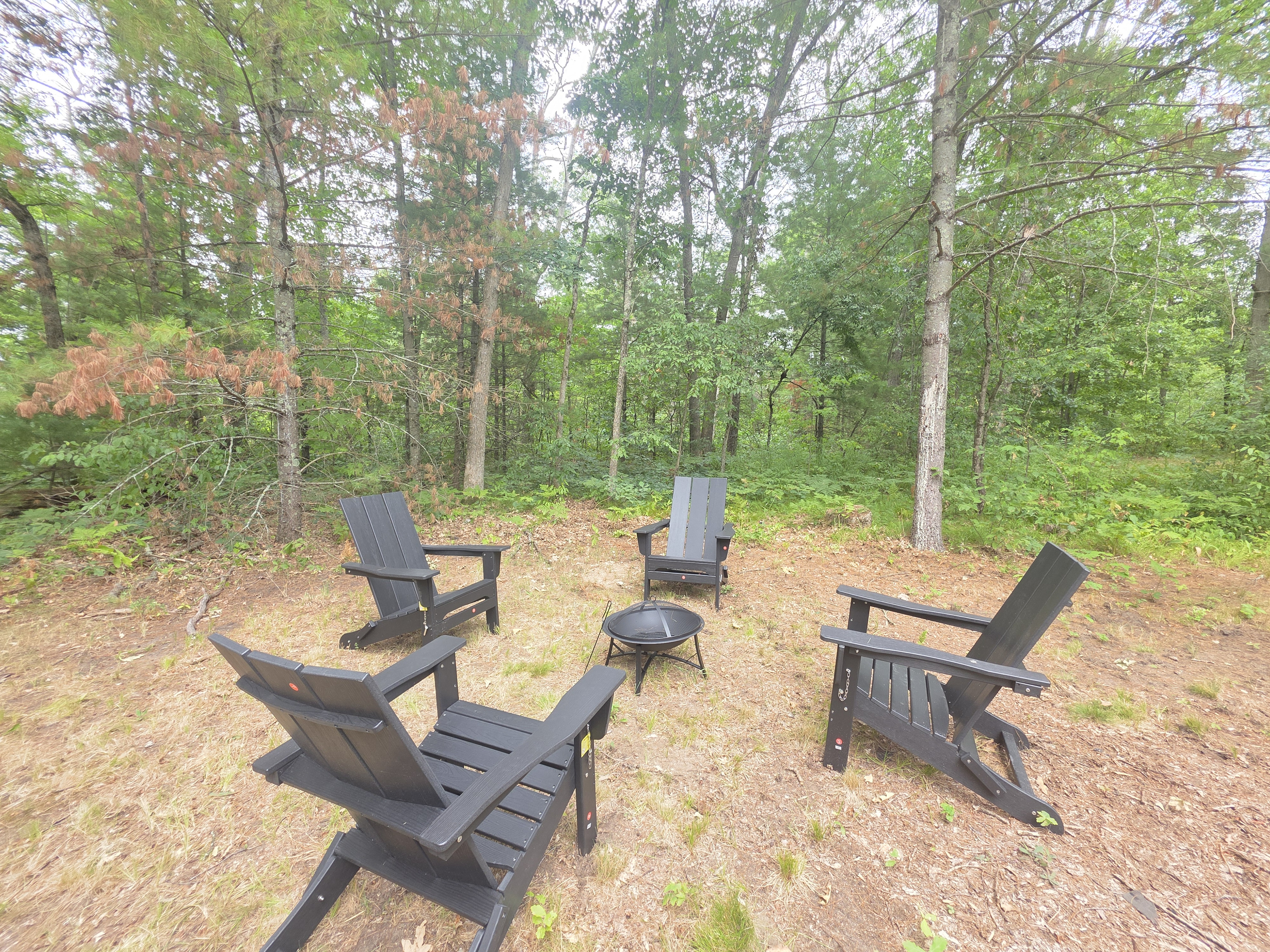 Fire pit with Adirondack chairs