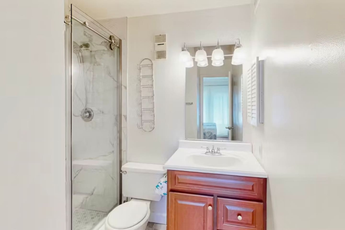 Bathroom with shower and vanity